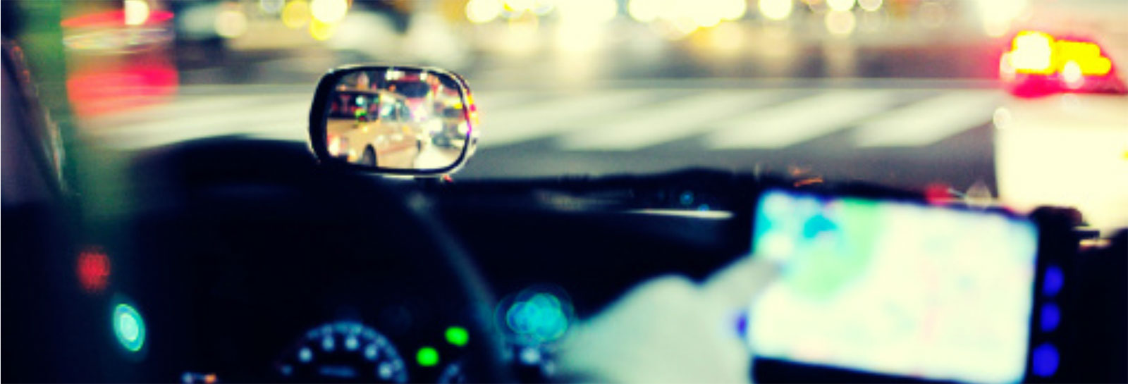 a blurred image of a car's dashboard