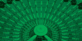 a monocolored green photo of a ferris wheel