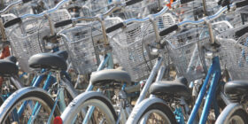 a bike rack full of bicycles