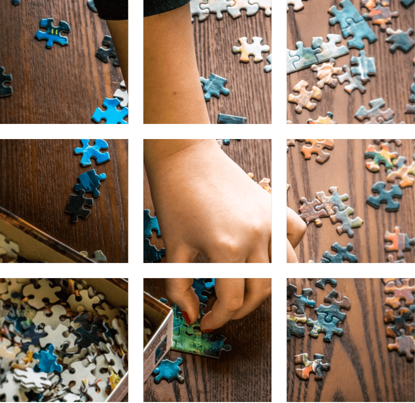 a person putting puzzles together