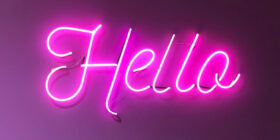neon hello text in the evening sky