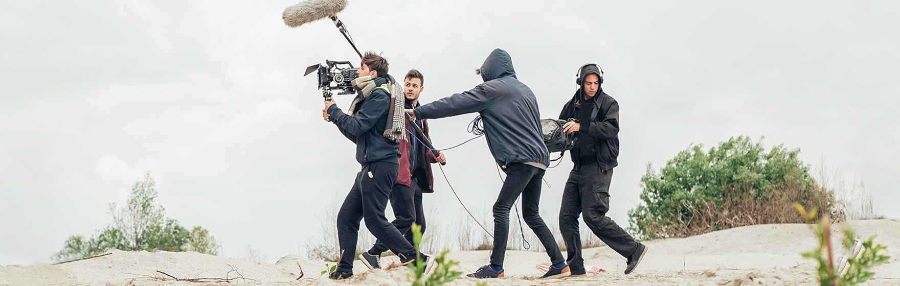 Behind the scene. Film crew team filming a scene on outdoor location